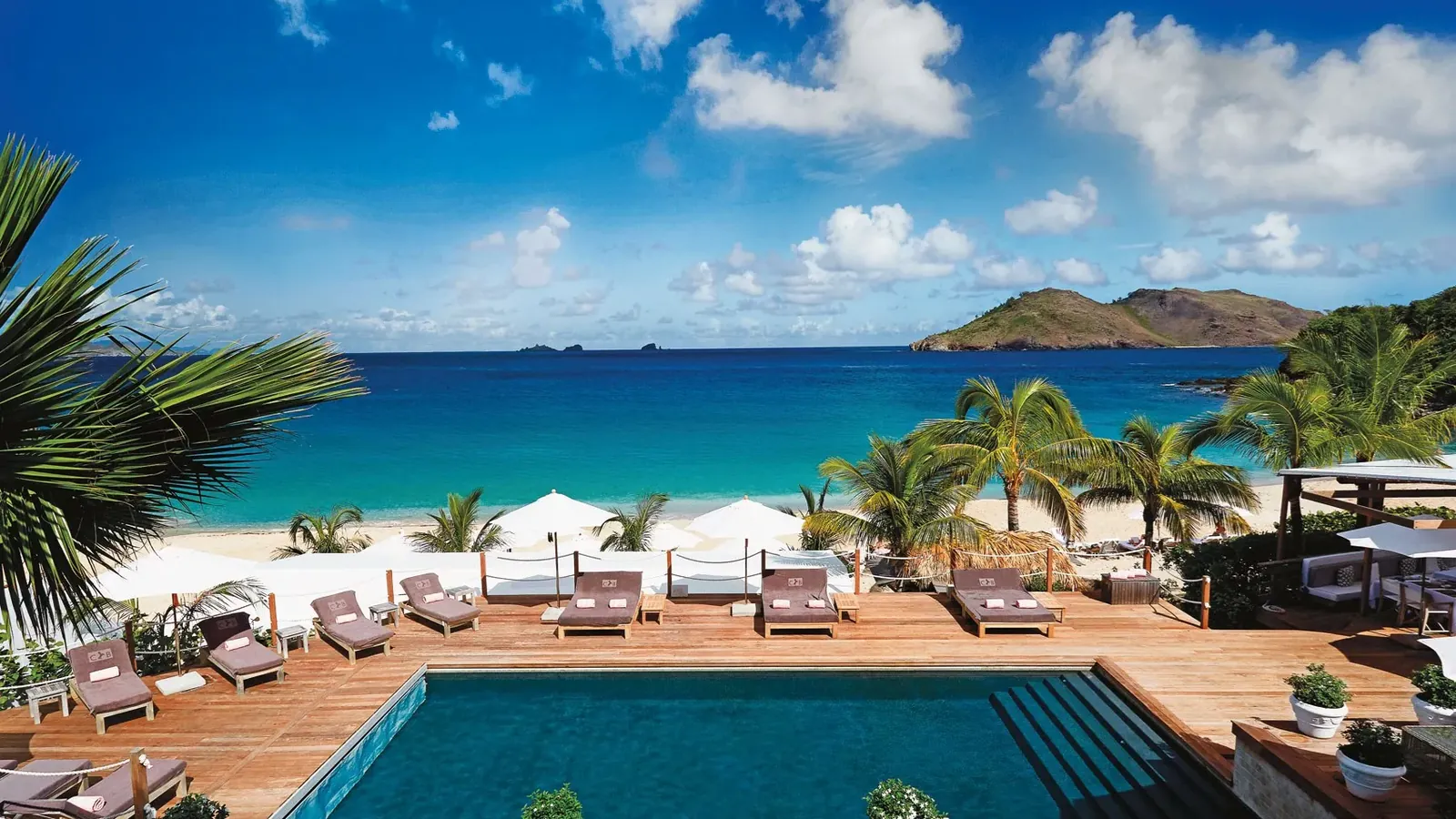 Beachfront resort pool and sun loungers, Saint-Barthélemy