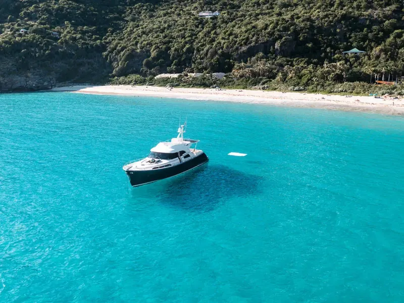 Charter boat at anchor off a white-sand beach, Saint-Barthélemy