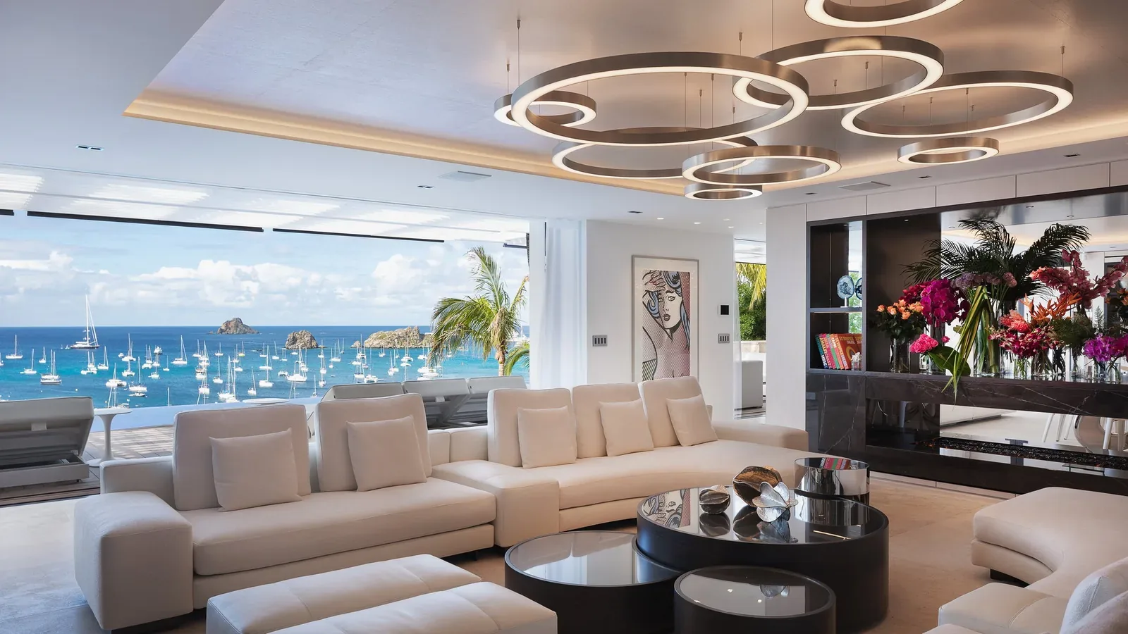 Villa living room prepared with fresh flowers and an ocean view, Saint-Barthélemy